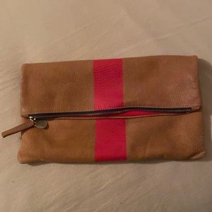 Clare Vivier tan clutch with pink stripe. Used condition.